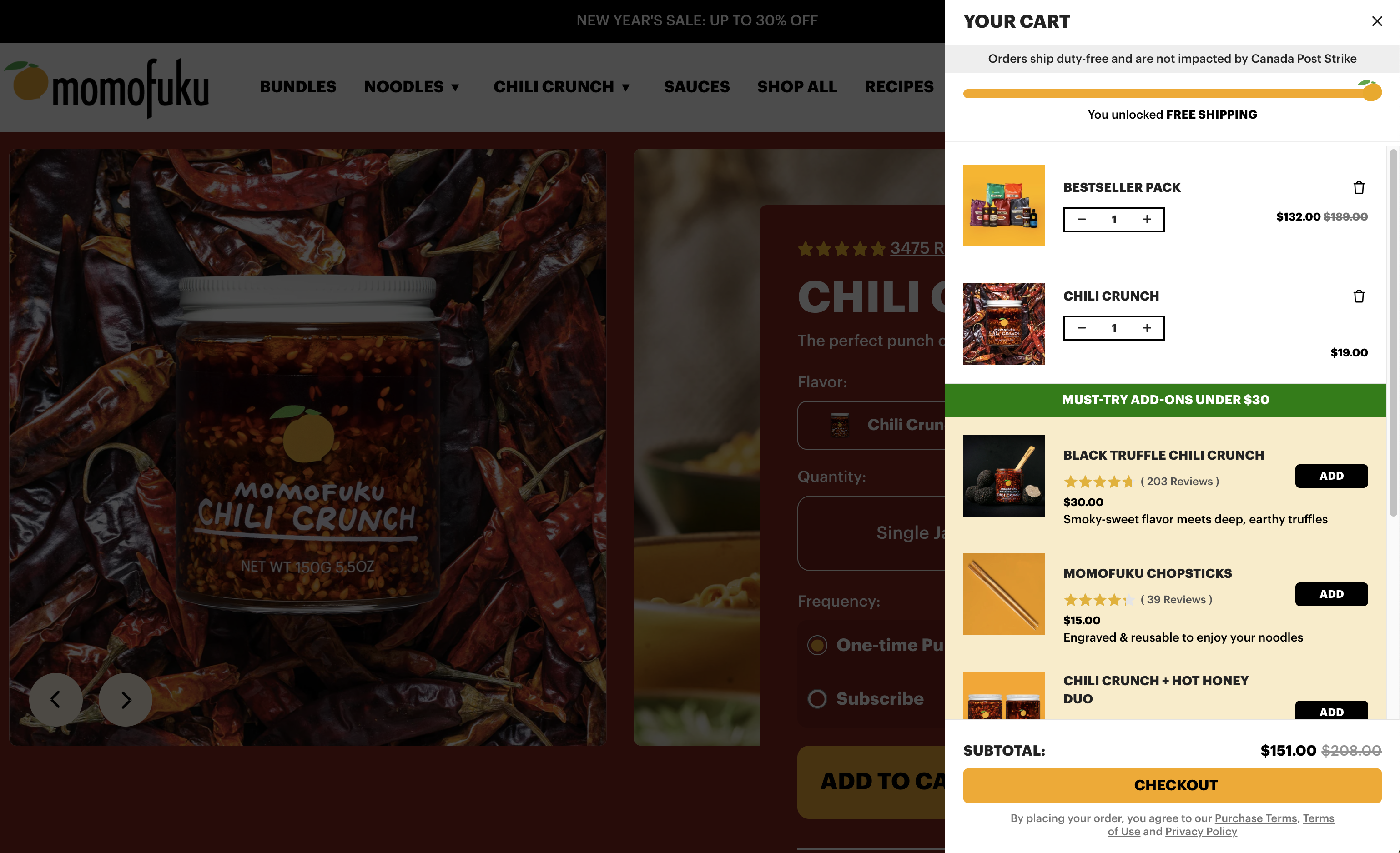 A screenshot of the Momofuku website with products in their Rebuy Smart Cart with in-cart recommendations and upsells